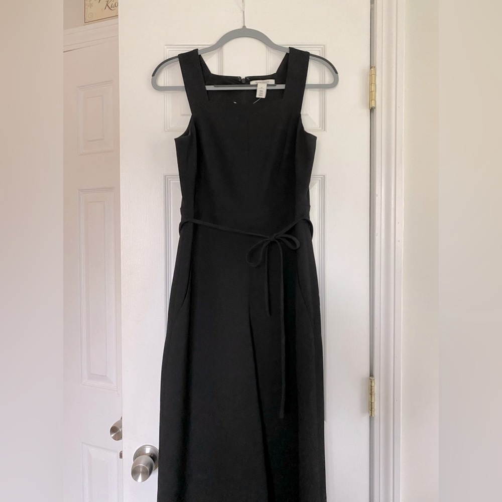 Black jumper with tie waist and zip back.